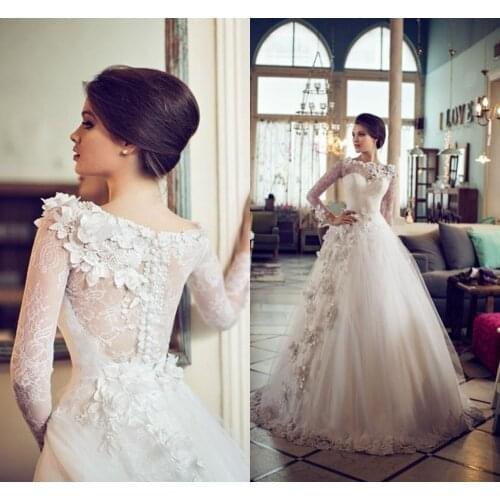 Illusion Neck A Line African Wedding Dresses Long Sleeves Sheer Button Back 3D Flowers Appliqued Tulle Bridal Gowns Custom