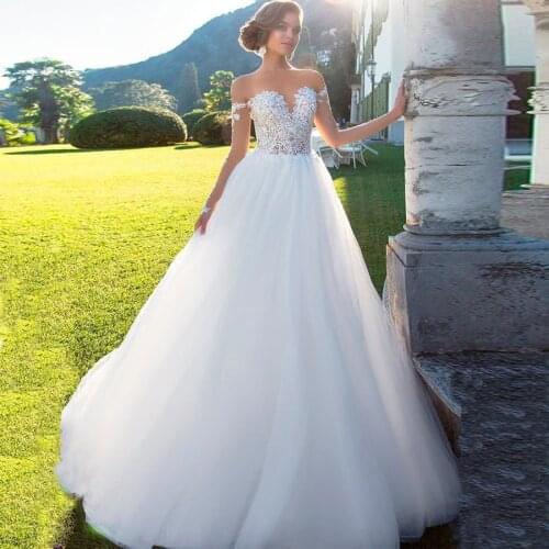 Sexy See-through Lace Wedding Dress Scoop Neck Long Sleeves Appliqued Vestido De Noiva Gown Backless Bride Dresses