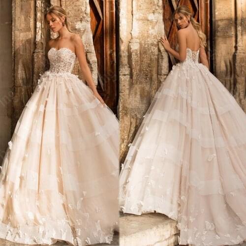 Luxury Ball Gown Champagne Wedding Dresses Tempting Lace Applique Bridal Gown Sweep Train Strapless Bride Dress Robe De Mariee