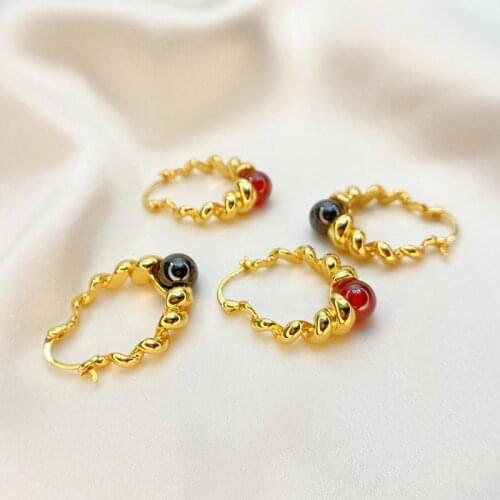 The new European and American retro temperament gold-encrusted gem-encrusted personality spiral earrings women