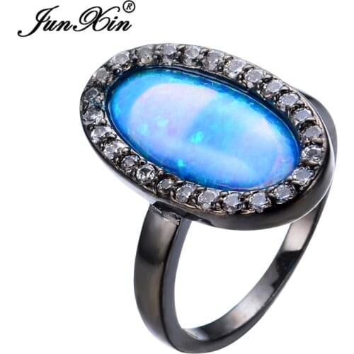 JUNXIN New Fashion Big Blue Fire Opal Rings For Women Black Gold Filled Party Charm Jewelry Wedding Band Finger Ring