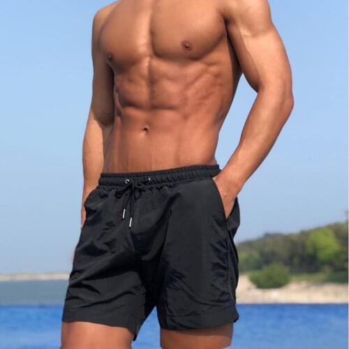 2021 summer new sports shorts mens summer mid-waist no liner pure cotton fitness three-point pants running squat casual pants