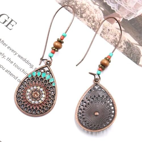 The New Fashion Jewelry Europe and America Brand Temperament Creative Teardrop-Shaped Alloy Eardrop Drip Flowers