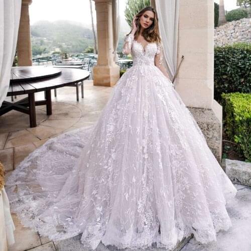 Luxury Long Sleeve Lace Princess Wedding Dresses 2020 V Neck Illusion Appliques Beaded Chapel Train Vintage Bridal Gowns