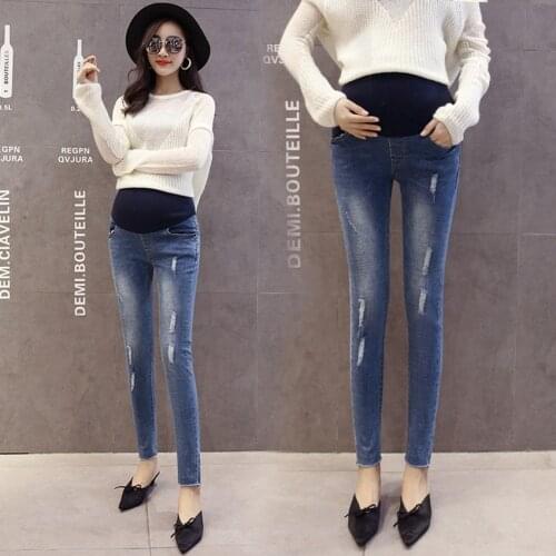 Pregnant women pants pants wear outside pregnant women jeans loose Korean autumn trousers nine points autumn
