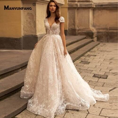 Elegant Deep V-Neck Cap Sleeve Chapel Train Bridal Ball Gown 2021 Hot Sale Backless Embroidery Appliques Tulle Wedding Dress