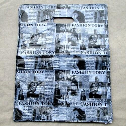 100pcs/lot free shipping.Gift bags.English newspaper design Plastic recycling useful/luggage bag gift store number 35*25cm