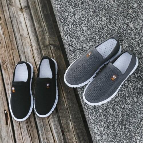 Soft-soled mens shoes spring 2021 new flying woven breathable lazy shoes car stitching student youth shoes