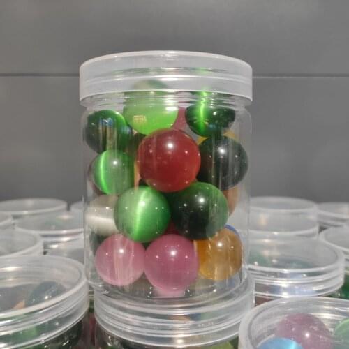A box Man Made Colorful Cat Eye Crystal Balls Spheres