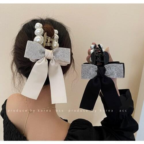 Dongdaemun, South Koreas fresh temperament catch clip with pearl and diamond bow tie catch hairpin literary fans hairpin