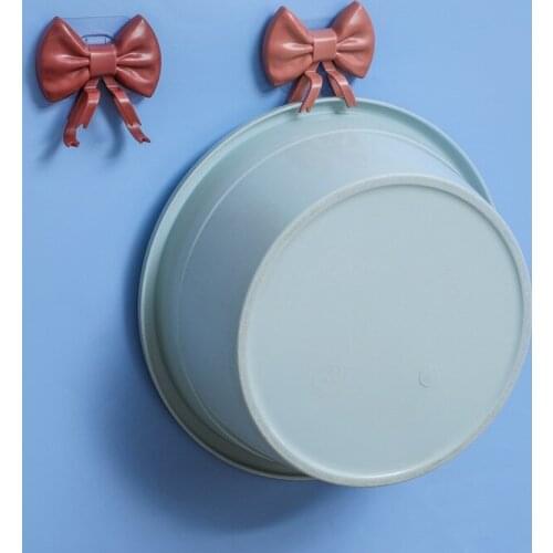 Creative Bow Bowknot Washbasin Hook Shelf Kitchen Bathroom Free Punch Wash basin Finishing Storage Rack Washbasin Stand