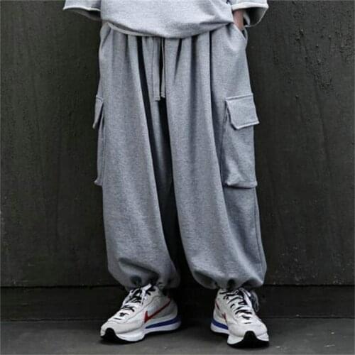 Mens summer large size solid color big pocket loose casual band tie fashion knickers youth fashion pants