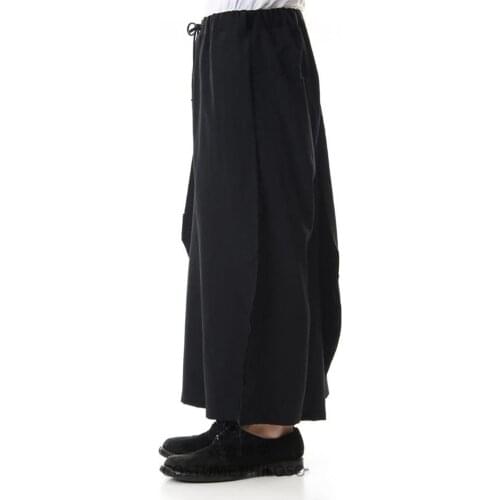 Mens new casual wide-leg pants culottes irregular asymmetric button design of urban youth fashion black