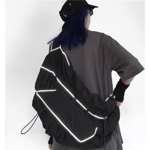 The new Korean version of the street reflective drawstring fold strappy dumpling bag couple shoulder messenger school bag men a