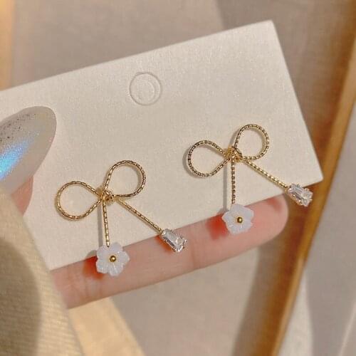 Small daisy earrings female simple temperament long tassel earrings niche design sense cold wind bow earrings