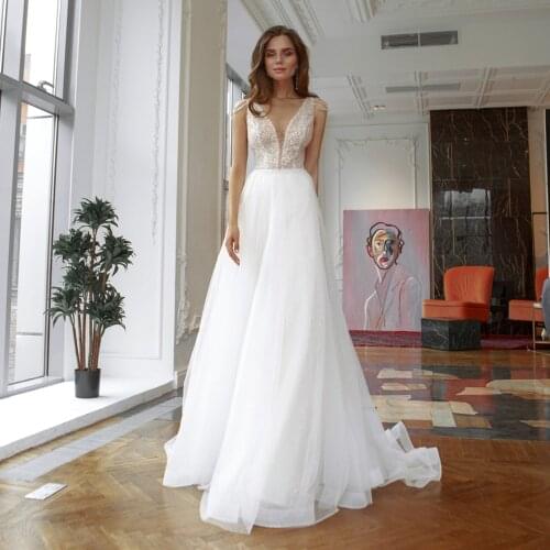 UZN Ivory A Line V Neck Beading Wedding Dress Sexy Backless Tulle Bridal Gown With Belt Vestido De Novia