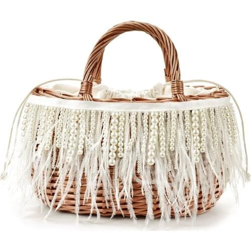 Early autumn 2020 new beige pearl tassel ostrich fur straw woven bag portable rattan bag travel holiday female bag