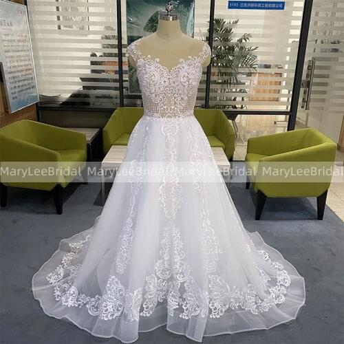 Sexy White Illusion Cap Sleeve Wedding Dress Luxury Appliques A-Line Transparent Buttons Bride Gown Princess Vestido de Noiva