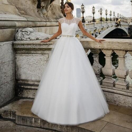 Modest O-neck A-line Bridal Gowns 2021 Applique Cap Sleeve Bow Custom Made Tulle Wedding Dress with Beading