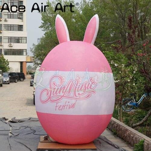 Hot sale inflatable Easter egg decoration free custom logo pink rabbit ear egg for parties and advertisements
