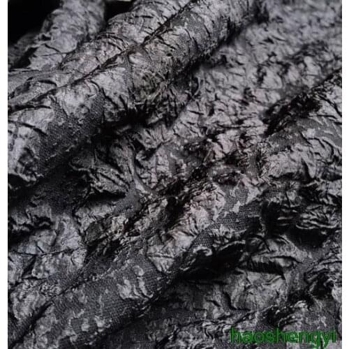 High-quality black fusion uneven texture fabric, pleated pleated garment fabric