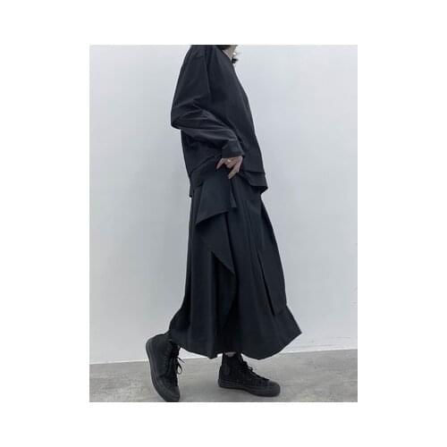 High-waisted hemline female autumn new style moisture quality random irregular medium-length a-line small black skirt