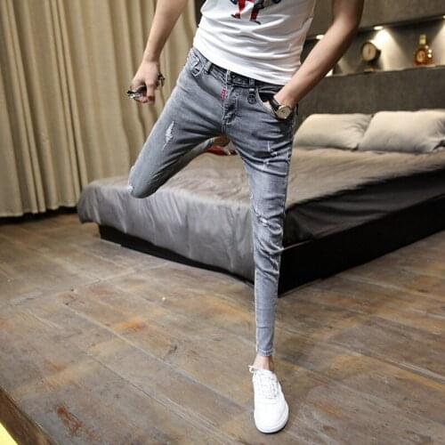 Wholesale 2021 Fashion social spirit guys small feet hole Skinny jeans mens students stretch slim Korean trend pencil pants