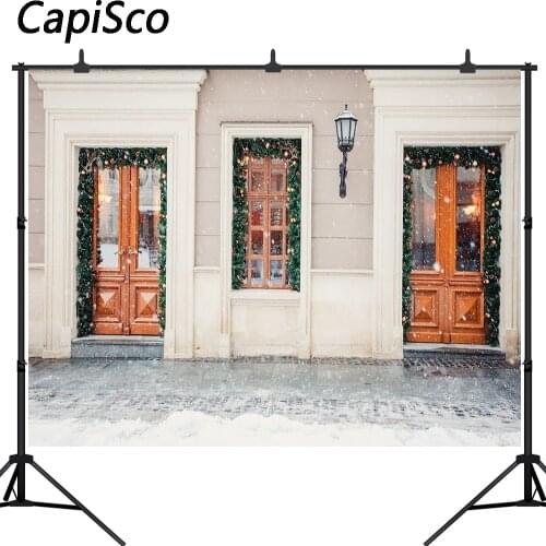 Capisco backdrops garland lights christmas decoration door building european city street shop winter holiday new year background