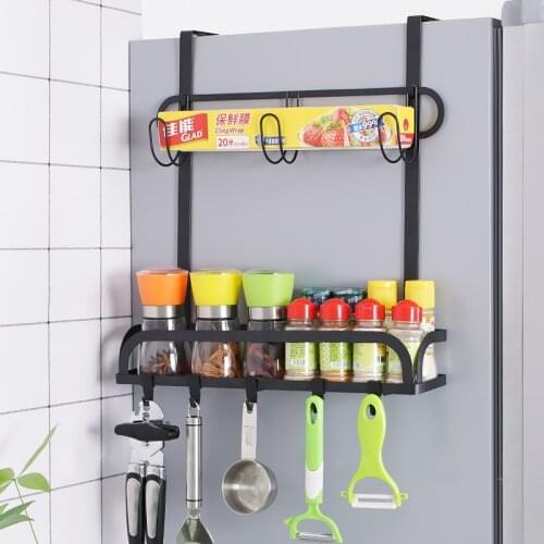 Black Multifunctional Refrigerator Rack The Side of The Refrigerator In The Kitchen Contains A Plastic Wrap Rack