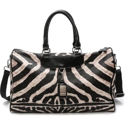 Hand-held travel bag female large-capacity duffel bag male Korean version of the simple gym bag light and waterproof tide