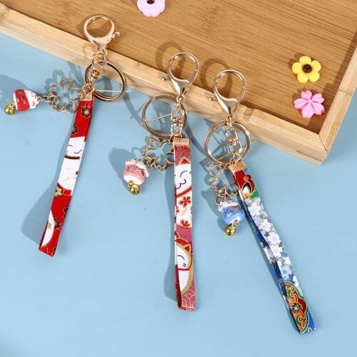 1Pc Cute Ceramics Maneki Neko Lucky Kawaii Cat Fortune Cat Sakura Keychain Key Chain Car Bag Pendent Mobile Accessories Women