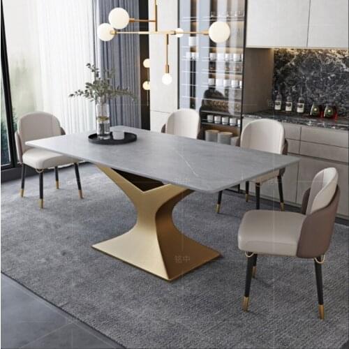 The minimalist slate table is suitable for the dining room with a modern long-shaped table marble dining table