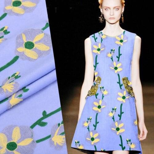 Yellow flower embroidered in the blue wool cloth unique embroidered wool fabric autumn winter characteristics of clothing fabric