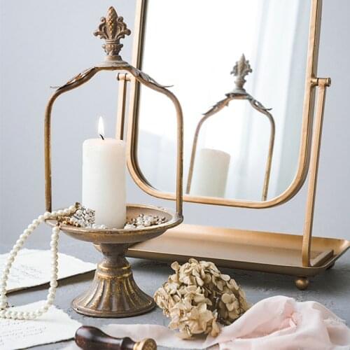 Vintage distressed decorative candlestick with old plant