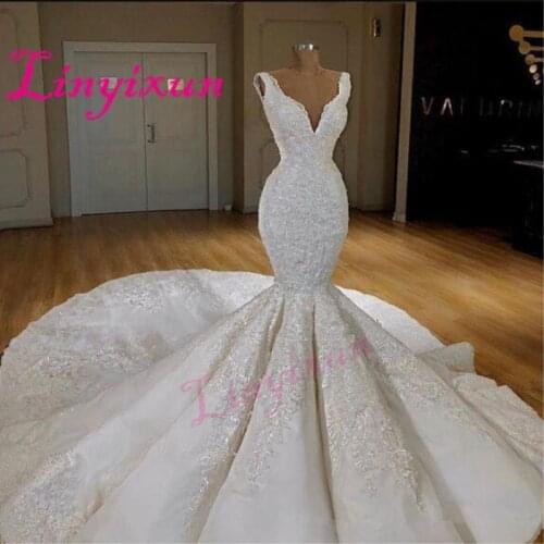 Dubai Sexy Corset Mermaid Wedding Dresses Deep V-Neck Sleeveless Lace Appliques Wedding Gowns 2018 Sweep Train Bridal Dress