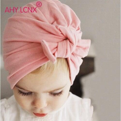 New hot selling Baby Cute Hat Knotted Rabbit Ears Model Cotton Tie Children Kids Cap Headwear for girl and boy baby