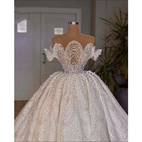 Luxury Ball Gown Pearls Wedding Dresses Lace Appliqued Sheer O Neck Dubai Arabia Bridal Gowns Vestidos De Novias