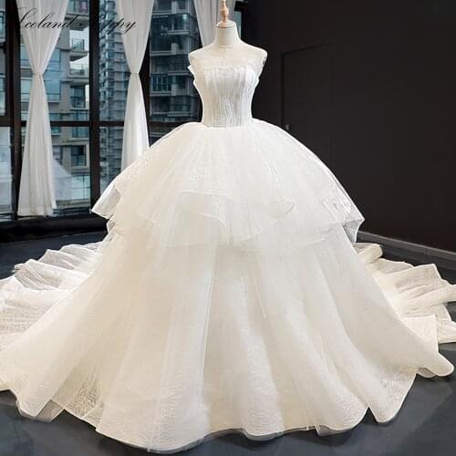 Lceland Poppy Strapless Ball Gown Wedding Dresses 2020 Sleeveless Ruched Floor Length Chapel Train Lace Up Tiered Bridal Gowns