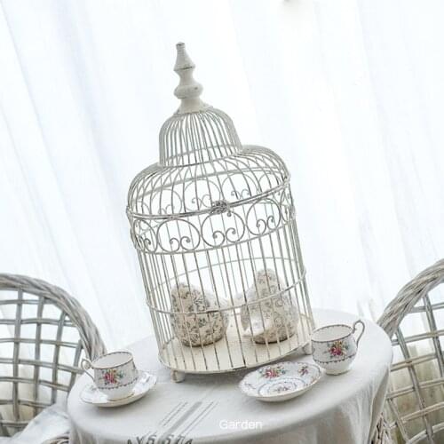 White retro vintage round metal bird cage for decoration