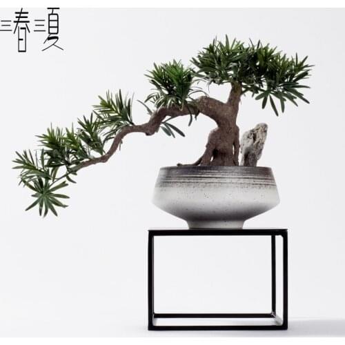 Simulation welcome pine bonsai decoration at the front desk of luohansong Hotel