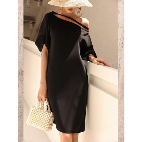 One line collar dress womens Bali holiday medium length loose and slim, small black dress with sloping shoulder dress 1212