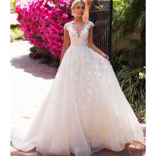 A-Line Sheer Neck Wedding Dress Lady Bridal White Charming Backless Cap Sleeve Lace Appliques Sequined Backless Bride Gowns 2021