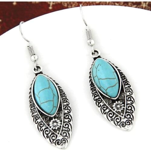 Female fashion ethical wind metal personality temperament restoring ancient green stone earrings