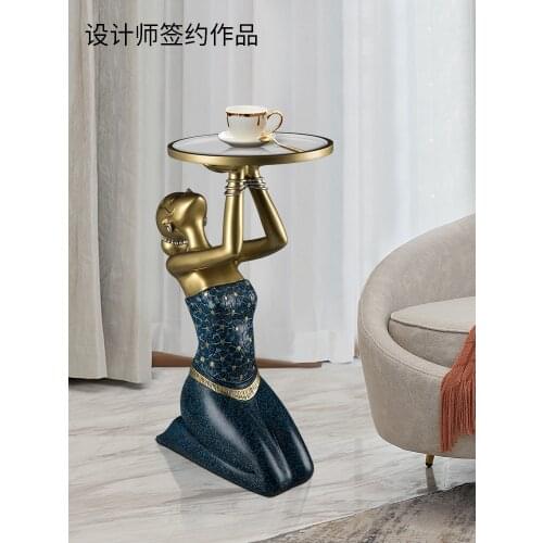 The modern light luxury living room is decorated with a large porch sofa beside the TV cabinet beauty site table