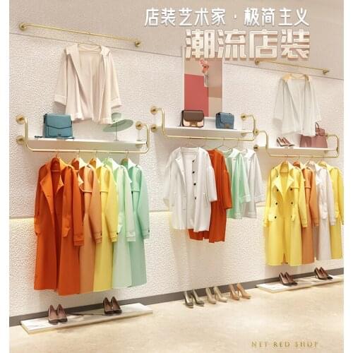 Clothing store display rack on the wall special shelf for womens clothing store golden iron wall hanging clothes hanger for chi