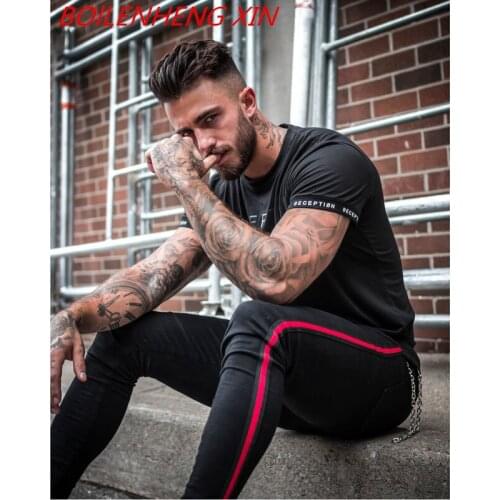 Springtime Men Ripped Skinny Zipper Jeans Black Patchwork Biker Pencil Pants Locomotive Denim Pants Draped Jeans Male