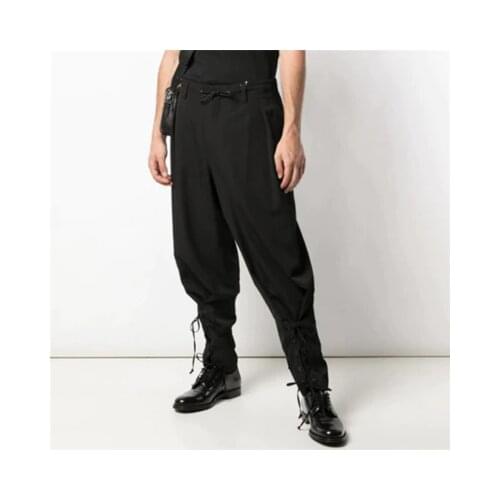 European New and American fashion mens casual pants leg bound youth loose leg pants belt decoration harem pants
