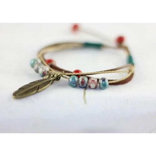 12 Pieces/Lot Leaf Charm Bracelets Women Men Ceramic Beads Feather Pendant Bangles Jewelry Leather Weave Chain Bell Wristband