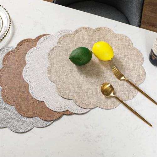 The new waterproof and oil-proof restaurant solid color round PU western placemat home insulation decorative table mat placemat