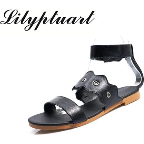2020 spring and summer new pu European and American style word buckle open toe solid color flat flat fashion wild sandals